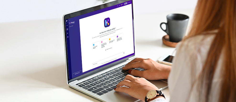 hands-on-laptop-keyboard-displaying-prosci-kaiya-ai-tool-for-change-management